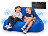 Two children laughing while sitting on a large blue inflatable bean bag chair, with a black audio device shown in the upper right and blue sound wave graphics around them.